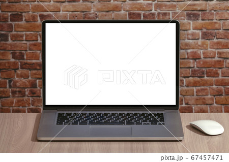 Laptop with white blank screen on the office desk Laptop with white blank screen on the office desk 67457471