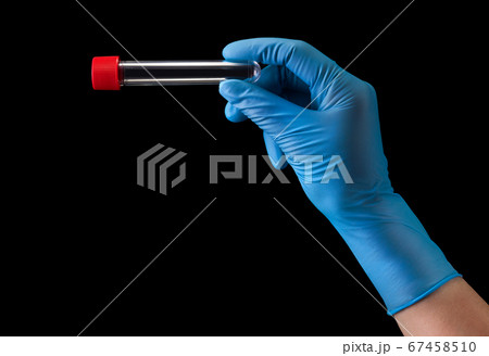 Doctor's hand in medical gloves holding test tube with coronavirus COVID-19 67458510