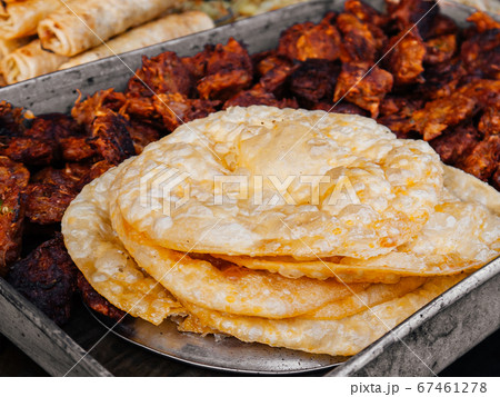 Crispy fried Naan bread or Roti in India, Bangladesh, Sri Lanka or Pakistan. Crispy fried Naan bread or Roti in India, Bangladesh, Sri Lanka or Pakistan. 67461278