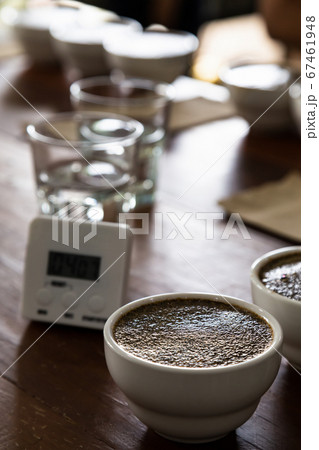 coffee grounds in cup on table preparing for professional Q Grader to test and inspect quality. coffee grounds in cup on table preparing for professional Q Grader to test and inspect quality. 67461948
