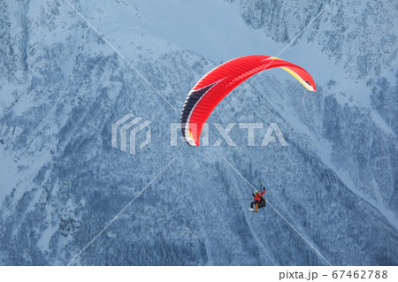 Paraglider in the mountains, winter landscape Paraglider in the mountains, winter landscape 67462788