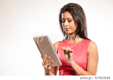 Mixed race african woman using pc tablet. 67463698