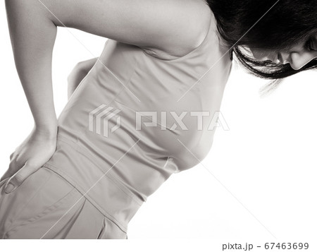 Woman suffering from backache back pain. Woman suffering from backache back pain. 67463699