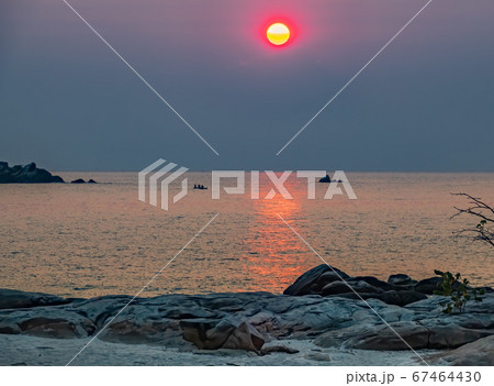 Sunrise over Malawi lake with fishing boats 67464430