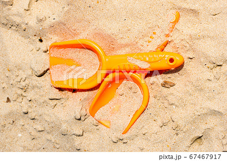 kid toys in sand 67467917