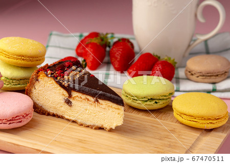 Piece of cheesecake with chocolate top and berries Piece of cheesecake with chocolate top and berries 67470511