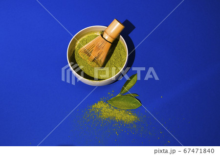 Matcha tea. A traditional oriental drink for health and energy. Powdered green tea and whisk Matcha tea. A traditional oriental drink for health and energy. Powdered green tea and whisk 67471840