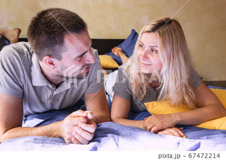 Couple lying on the bed at home 67472214