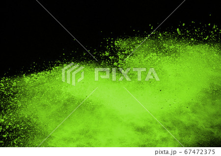 The movement of abstract dust explosion frozen green on black background. Stop the movement of powdered green on black background. Explosive powder green on black background. The movement of abstract dust explosion frozen green on black background. Stop the movement of powdered green on black background. Explosive powder green on black background. 67472375