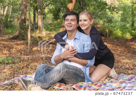 Romantic young couple hugging and laughing 67473237