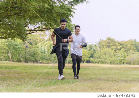 Activity two people running together with tree on Activity two people running together with tree on 67473245