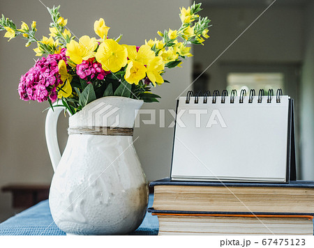 Beautiful flowers lying on a wooden table 67475123