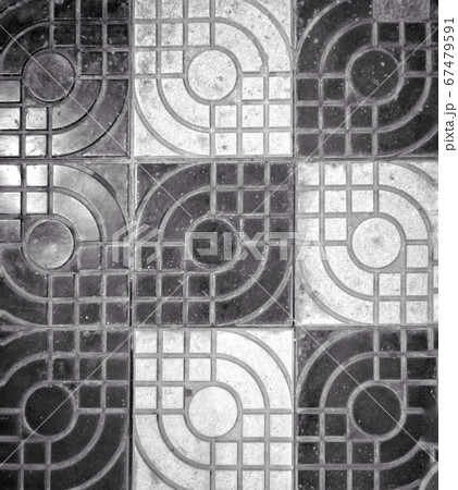 A black and white photo of black and white dirty stone tiles used for covering floor A black and white photo of black and white dirty stone tiles used for covering floor 67479591