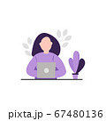 Woman sitting at the desk and working at her laptop 67480136