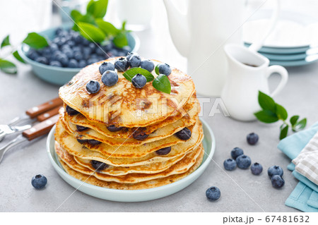 Blueberry pancakes with butter, maple syrup and 67481632
