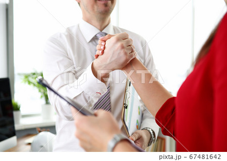Meeting employees shake hands as sign friendship Meeting employees shake hands as sign friendship 67481642