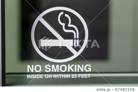 No Smoking sign on a glass surface No Smoking sign on a glass surface 67482358