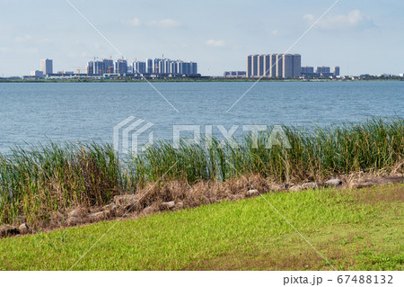 The city on the opposite side of the lake. 67488132