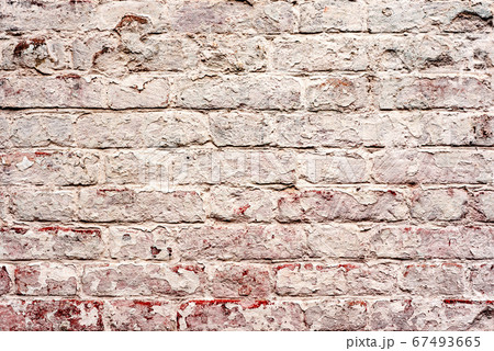 Texture of a brick wall with cracks and scratches Texture of a brick wall with cracks and scratches 67493665