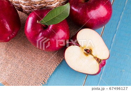 Group of red apples with their leaves Group of red apples with their leaves 67496127
