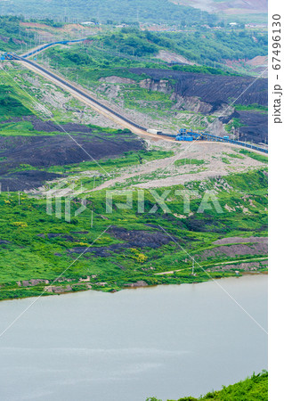 Part of a pit with big mining truck working. Coal Part of a pit with big mining truck working. Coal 67496130