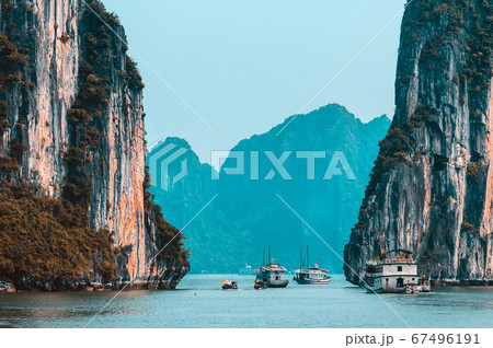Rock islands near floating village in Halong Bay. Rock islands near floating village in Halong Bay. 67496191