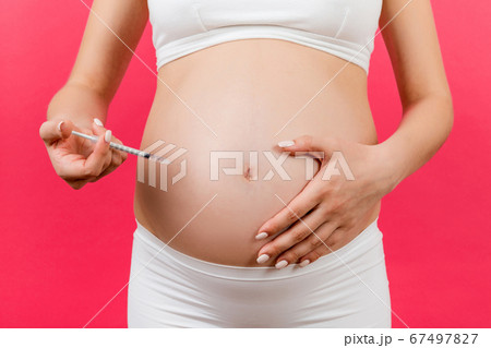 Cropped image of pregnant woman making insulin 67497827