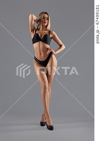Woman on heels posing in lingerie. 67499181