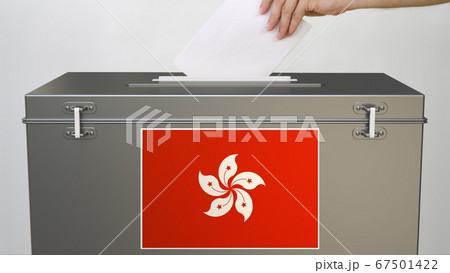 Hand putting paper ballot into ballot box with flag of Hong kong. Election related 3d rendering Hand putting paper ballot into ballot box with flag of Hong kong. Election related 3d rendering 67501422