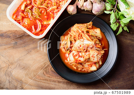 Kimchi cabbage on plate and bowl on wooden background, Korean food Kimchi cabbage on plate and bowl on wooden background, Korean food 67501989