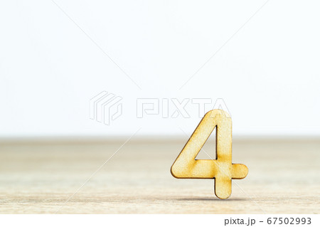 Wooden numeric on table ,number four 67502993