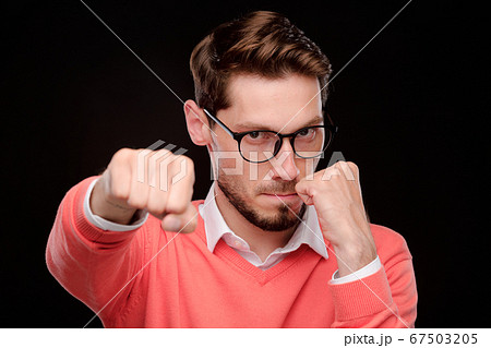 Man throwing punch 67503205