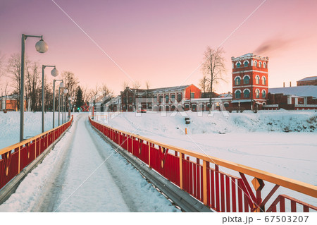 Dobrush, Gomel Region, Belarus. Old Paper Factory Tower In Winter Evening. Historical Heritage 67503207