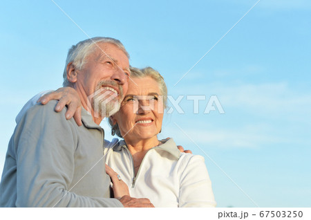 Close-up portrait of happy senior couple hugging Close-up portrait of happy senior couple hugging 67503250