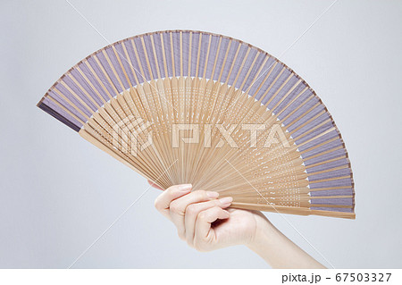 Hand Holding A Fan Stock Photo