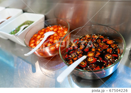Street food market in Asia. Bowls with hot sauces 67504226