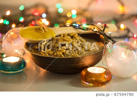 Christmas kutia from wheat, raisins and nuts, selective focus Christmas kutia from wheat, raisins and nuts, selective focus 67504790