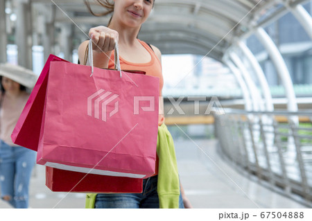 Shopaholic Women holding shopping bags ,money Shopaholic Women holding shopping bags ,money 67504888