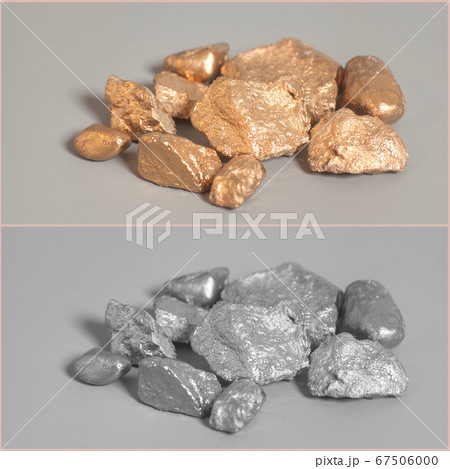 Silver end golden nuggets on gray background Silver end golden nuggets on gray background 67506000