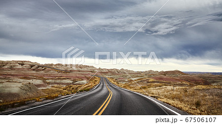 Stormy clouds over road in Badlands National Park, Stormy clouds over road in Badlands National Park, 67506107