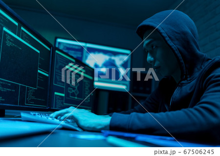 Asian male hacker use laptop Asian male hacker use laptop 67506245