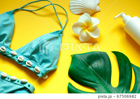 set of summer beach accessories on a yellow background 67506982