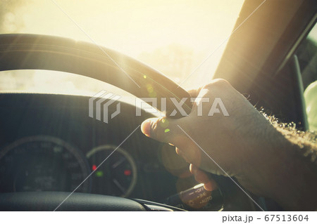 A man driving car in sunlight weather 67513604