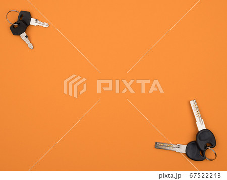 Keychain on an orange background. Close-up. The Keychain on an orange background. Close-up. The 67522243