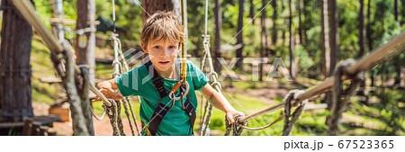 Portrait of cute little boy walk on a ropeの写真素材 [67523365] - PIXTA