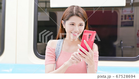 Girl use smartphone in metro Girl use smartphone in metro 67528694