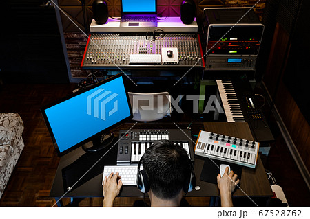 back of asian producer, sound engineer working in recording, broadcasting studio back of asian producer, sound engineer working in recording, broadcasting studio 67528762