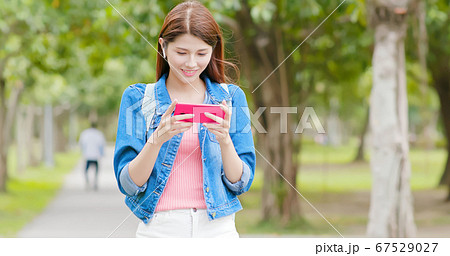 woman use ear bud woman use ear bud 67529027