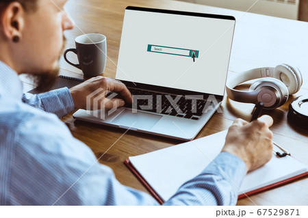 Man looking for job from home during coronavirus or COVID-19 quarantine, remote office concept. 67529871