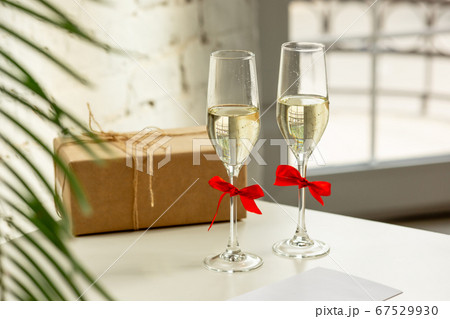 Glasses of sparkling champagne, close up. Warm colored. Celebration event, holidays, drinks concept Glasses of sparkling champagne, close up. Warm colored. Celebration event, holidays, drinks concept 67529930